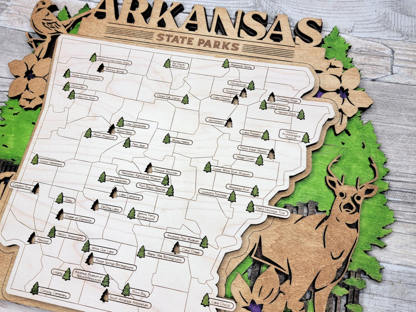 Premium wood Arkansas adventure map with engraved state park names and detailed cutouts.