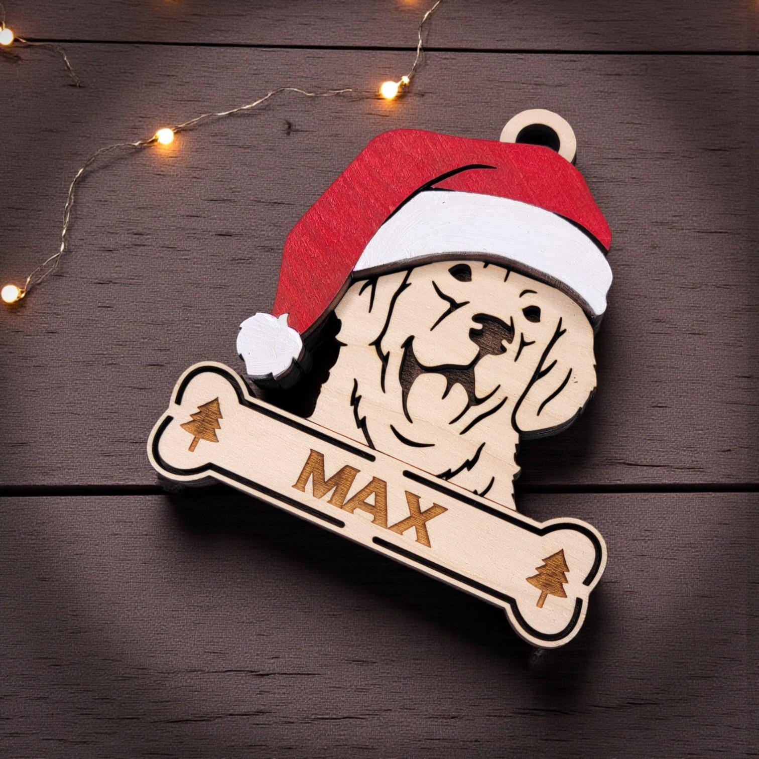 Engraved Golden Retriever Christmas ornament with personalized name on wood background