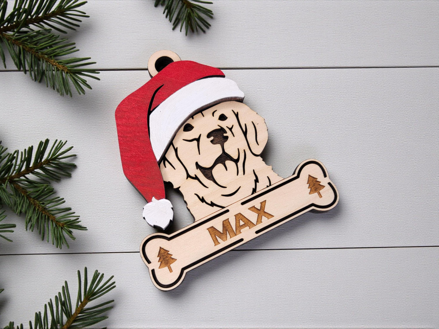 Wooden Golden Retriever silhouette ornament hanging on Christmas tree with lights