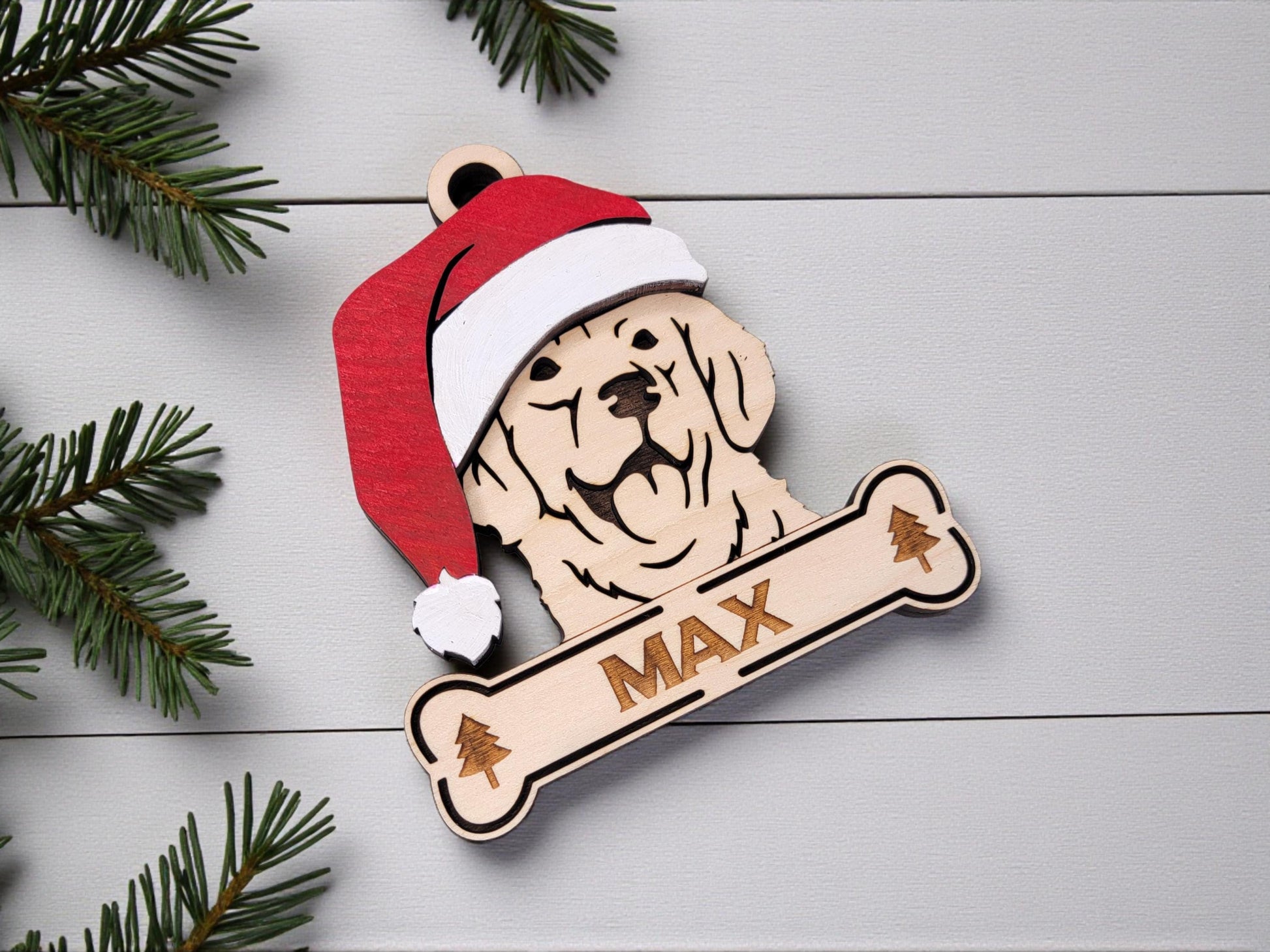 Wooden Golden Retriever silhouette ornament hanging on Christmas tree with lights